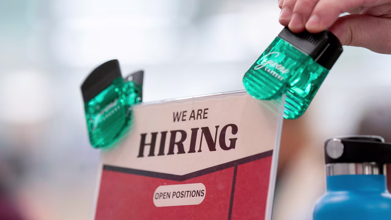 Hiring signage is displayed at a job and resource fair in Hendersonville, North Carolina, US, on November 19.