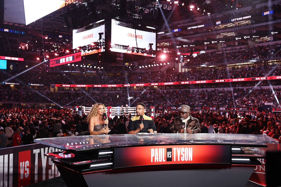 From left: Kate Abdo, Andre Ward and Cedric the Entertainer speak during the broadcast for LIVE On Netflix: Jake Paul vs. Mike Tyson.