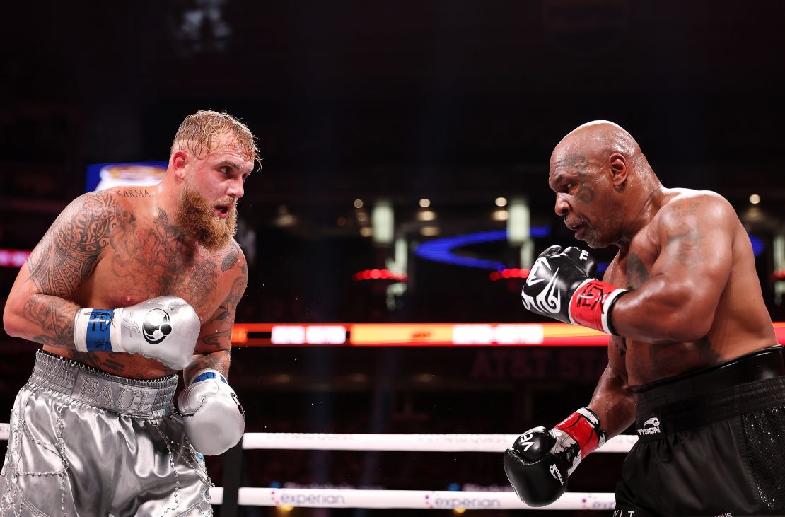 ARLINGTON, TEXAS - NOVEMBER 15: (L-R) Jake Paul and Mike Tyson fight during LIVE On Netflix: Jake Paul vs. Mike Tyson at AT&T Stadium on November 15, 2024 in Arlington, Texas. (Photo by Al Bello/Getty Images for Netflix © 2024)