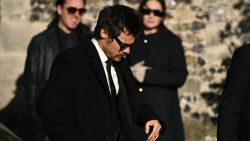 British singer Harry Styles arrives to attend the funeral service of the late One Direction singer Liam Payne, at a church in the Home Counties, to the west of London on November 20, 2024. Payne was found dead on October 16, 2024 after plunging from the balcony of his third-floor hotel room in Buenos Aires. (Photo by JUSTIN TALLIS / AFP) (Photo by JUSTIN TALLIS/AFP via Getty Images)