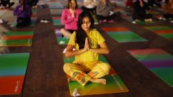 SAVANNAH, GEORGIA - NOVEMBER 15: Guests practice yoga at Team Milk's Every Woman's Marathon Wellness Fair & Expo on November 15, 2024 in Savannah, Georgia.  (Photo by Carol Lee Rose/Getty Images for Every Woman's Marathon)