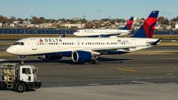 Delta Air Lines Airbus A220-300 passenger aircraft spotted taxiing on the runway and taxiway of LaGuardia airport in NYC with a Boeing 737 of Delta in arriving in the background. The narrow body Airbus A220 formerly Bombardier CS300 BD-500-1A11 of Delta Airlines has the registration tail number N301DU and is powered by 2x PW jet engines. Delta Air Lines is a major airline carrier in the United States of America with headquarters and hub in Atlanta, Georgia, member of SkyTeam aviation alliance group. Delta is the second largest airline in the world with a fleet of 993 planes and ranked as the best in the US. LaGuardia Airport LGA, Queens, New York City, USA on November 12, 2024 (Photo by Nicolas Economou/NurPhoto via Getty Images)