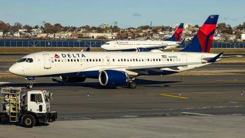 Delta Air Lines Airbus A220-300 passenger aircraft spotted taxiing on the runway and taxiway of LaGuardia airport in NYC with a Boeing 737 of Delta in arriving in the background. The narrow body Airbus A220 formerly Bombardier CS300 BD-500-1A11 of Delta Airlines has the registration tail number N301DU and is powered by 2x PW jet engines. Delta Air Lines is a major airline carrier in the United States of America with headquarters and hub in Atlanta, Georgia, member of SkyTeam aviation alliance group. Delta is the second largest airline in the world with a fleet of 993 planes and ranked as the best in the US. LaGuardia Airport LGA, Queens, New York City, USA on November 12, 2024 (Photo by Nicolas Economou/NurPhoto via Getty Images)
