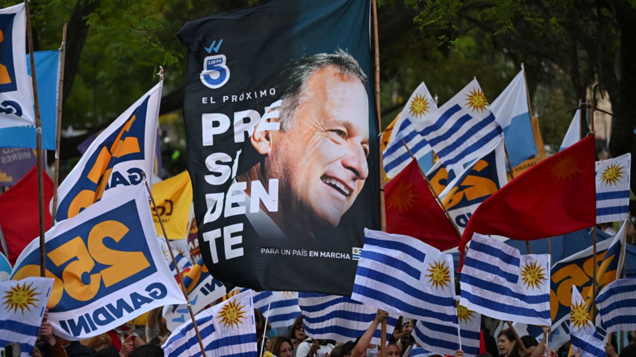 ers of Uruguay's presidential candidate for the Republican Coalition, Alvaro Delgado, attend his campaign closing rally in Montevideo on November 20, 2024. Alvaro Delgado of outgoing President Luis Lacalle Pou's ruling coalition and Yamandu Orsi of the left-wing Frente Amplio party will go head-to-head in the November 24 election run-off. (Photo by Eitan ABRAMOVICH / AFP) (Photo by EITAN ABRAMOVICH/AFP via Getty Images)