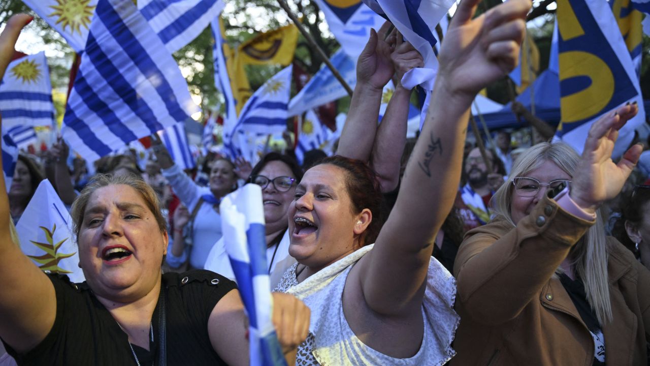 Supporters of Uruguay's presidential candidate for the Republican Coalition, Alvaro Delgado, attend his campaign closing rally in Montevideo on November 20, 2024. Alvaro Delgado of outgoing President Luis Lacalle Pou's ruling coalition and Yamandu Orsi of the left-wing Frente Amplio party will go head-to-head in the November 24 election run-off. (Photo by Eitan ABRAMOVICH / AFP) (Photo by EITAN ABRAMOVICH/AFP via Getty Images)