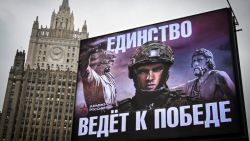 The Russian Foreign Ministry building is seen behind the Army billboard reading "The Unity Leads to the Victory!" in Moscow on November 21, 2024. Russia's Foreign Ministry spokeswoman Maria Zakharova received a phone call during a live press briefing ordering her not to comment on reports of a ballistic missile strike on Ukraine, video showed. "On the 'Yuzhmash' ballistic missile strike that the Westerners have started talking about, we are not commenting at all," she said, referring to an aerospace manufacturer based in the Ukrainian city of Dnipro. (Photo by Alexander NEMENOV / AFP) (Photo by ALEXANDER NEMENOV/AFP via Getty Images)