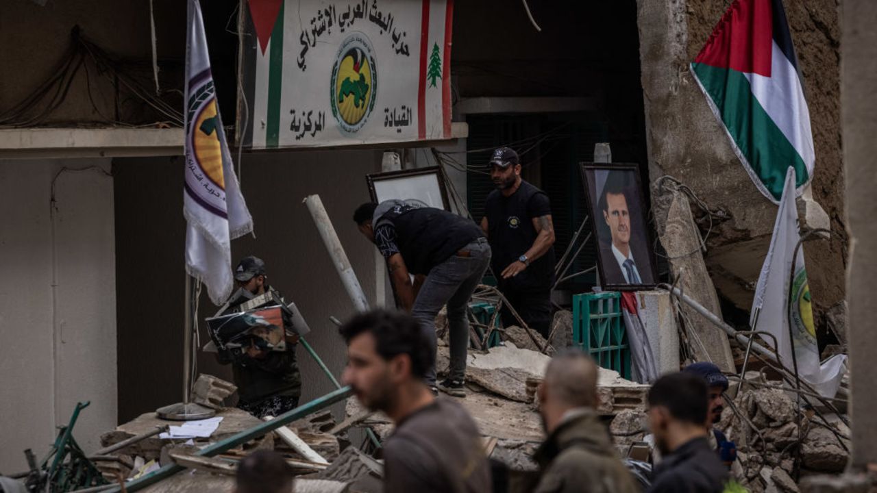 BEIRUT, LEBANON - NOVEMBER 17: Civil defence workers, locals and Lebanese Armer Forces soldiers attend the site of an Israeli airstrike allegedly targeted and killed Hezbollah spokesman Mohammed Afif in a building at Ras al-Nabaa neighbourhood in Beirut on November 17, 2024 in a southern suburb of Beirut, Lebanon. The strike in the central Beirut area of Ras al-Naba reportedly targeted a building where it is believed the Syrian Social Nationalist Party was headquartered. IDF strikes in recent weeks have primarily been aimed at the Hezbollah stronghold in the southern suburbs of Beirut. (Photo by Ed Ram/Getty Images)