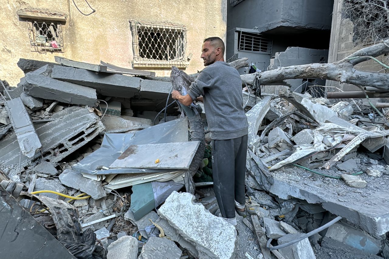 A Palestinian inspects the rubble of a building in Beit Lahia, Gaza on November 21.