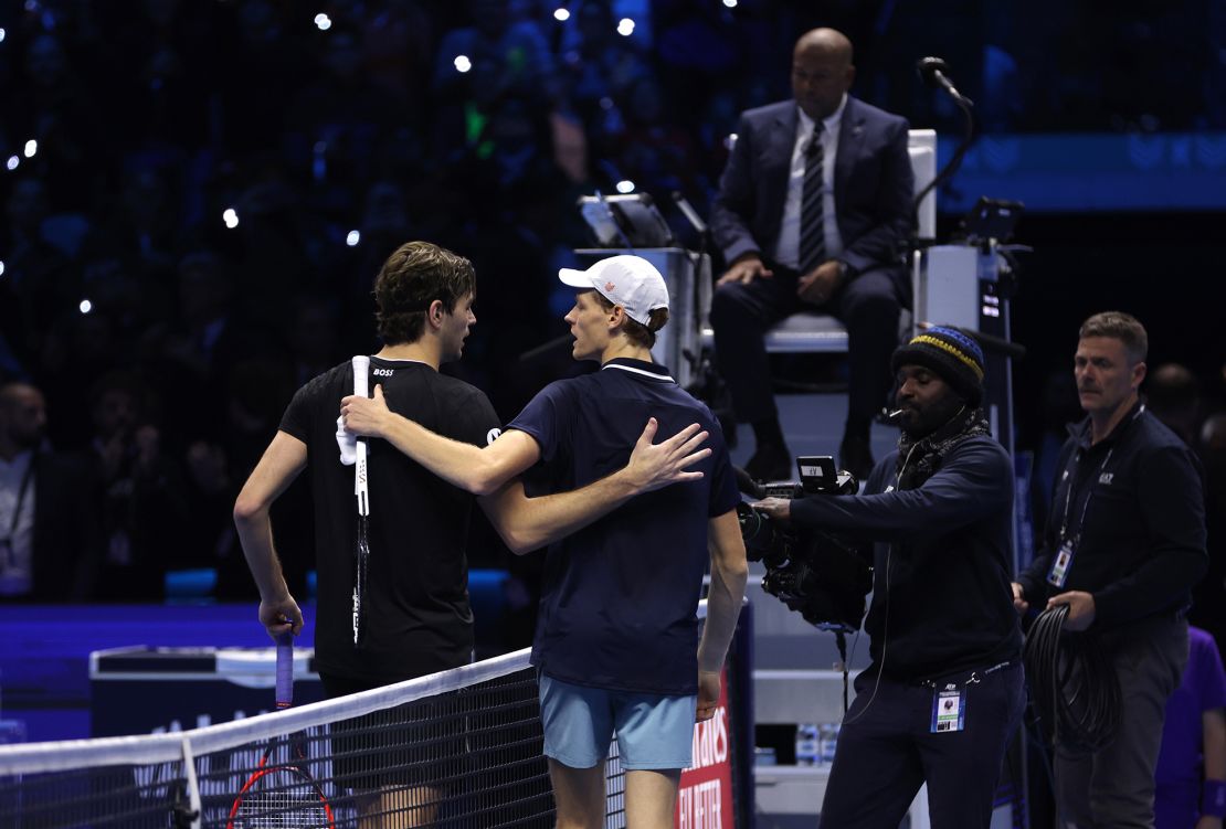 Fritz and Sinner greet each other at the net after the match.