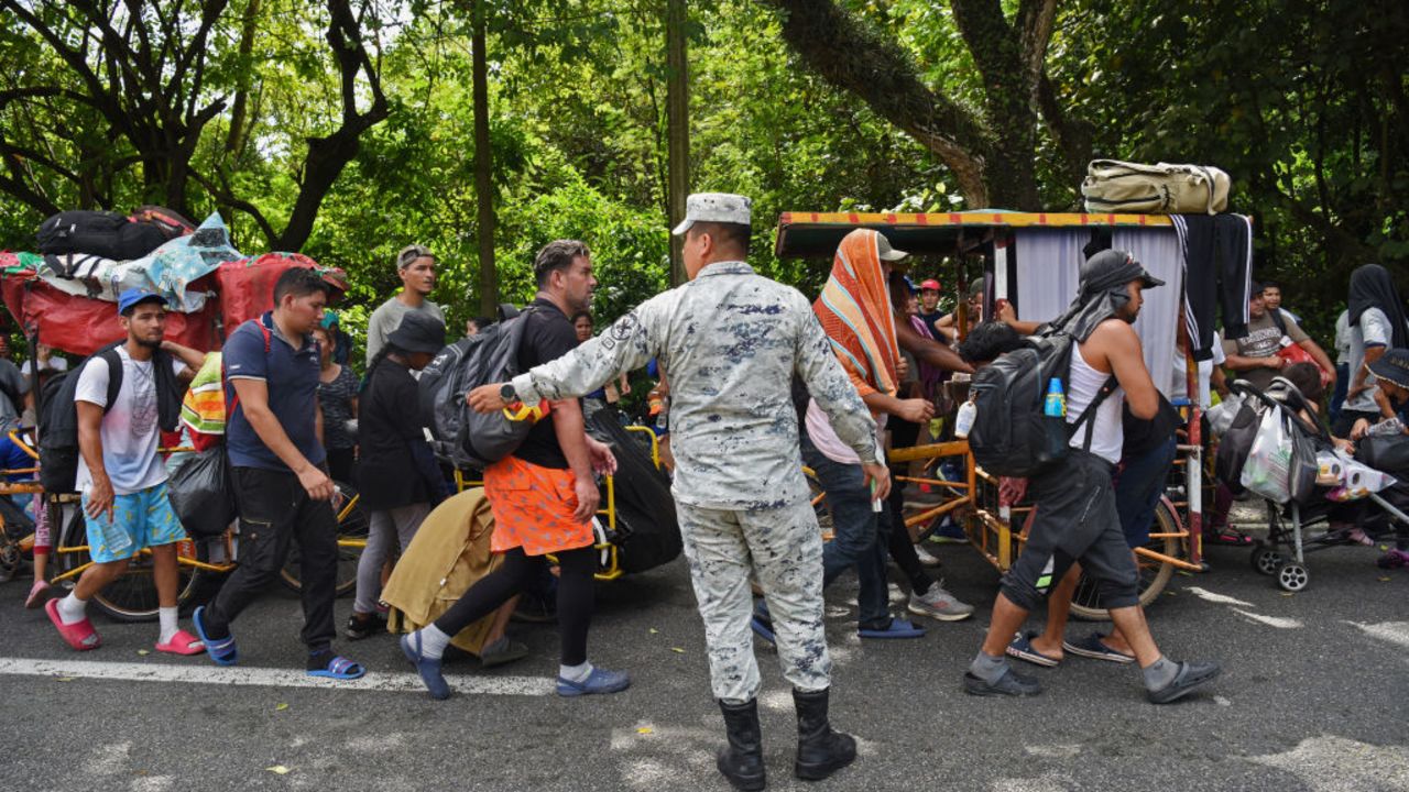 Migrants of several nationalities bound to the Mexico-US border walk through Huixtla, Chiapas State, Mexico on November 21, 2024. (Photo by ISAAC GUZMAN / AFP) (Photo by ISAAC GUZMAN/AFP via Getty Images)