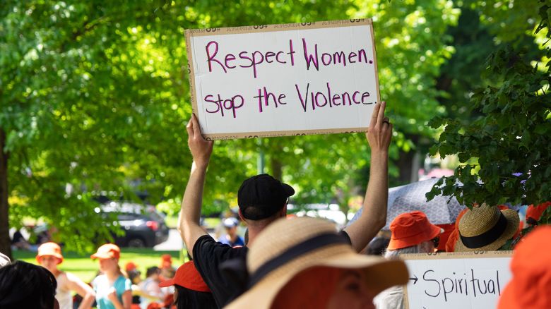 An attendee holds an anti-domestic-violence sign during a march demanding an end to domestic violence and femicide in Melbourne, Australia, on November 22, 2024.