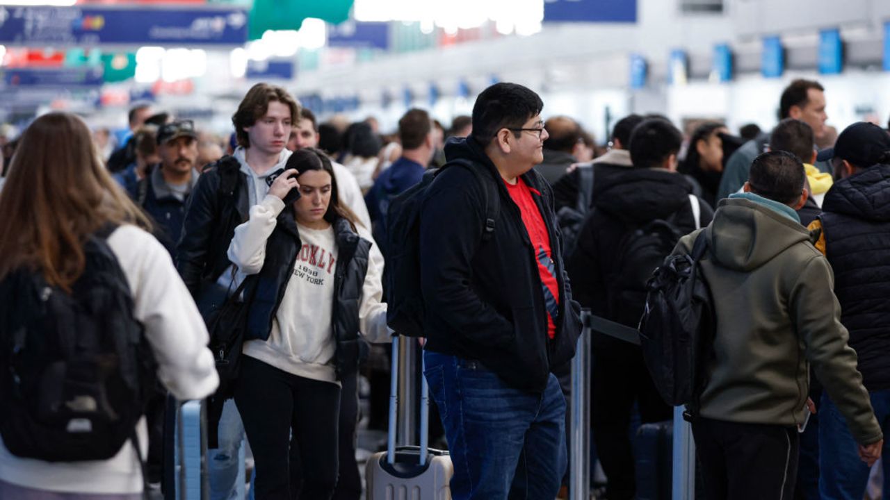 Travelers walk through O'Hare International Airport in Chicago, Illinois, on November 22, 2024, ahead of the upcoming Thanksgiving holiday. (Photo by KAMIL KRZACZYNSKI / AFP) (Photo by KAMIL KRZACZYNSKI/AFP via Getty Images)