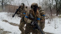 TOPSHOT - Civilians wearing military uniforms take part in a military training organized by Ukrainian soldiers of The Third Separate Assault Brigade in Kyiv, on November 23, 2024, amid the Russian invasion of Ukraine. (Photo by Tetiana DZHAFAROVA / AFP) (Photo by TETIANA DZHAFAROVA/AFP via Getty Images)