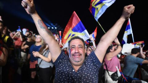 TOPSHOT - A er of Uruguay's president-elect, Yamandu Orsi, of the Frente Amplio coalition, celebrates after the presidential runoff election in Montevideo on November 24, 2024. The leftist Yamandú Orsi, elected president of Uruguay after Sunday's ballot, promised to call 'again and again' for national dialogue in a speech to his ers after the election results showed him as the winner. (Photo by Dante FERNANDEZ / AFP) (Photo by DANTE FERNANDEZ/AFP via Getty Images)