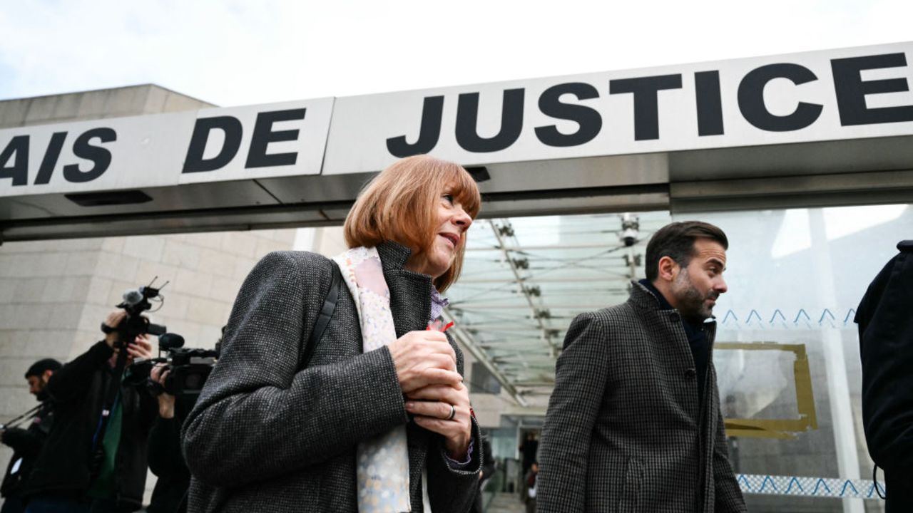 Gisele Pelicot looks on (C) next to her lawyer Antoine Camus (R) as she leaves the Avignon courthouse during the trial of her former partner Dominique Pelicot accused of drugging her for nearly ten years and inviting strangers to rape her at their home in Mazan, a small town in the south of France, in Avignon, on November 25, 2024. French prosectors said on November 25, 2024, they were seeking the maximum 20-year jail term for the man charged with enlisting dozens of strangers to rape his heavily-sedated wife, in a trial that has shaken France. (Photo by Christophe SIMON / AFP) (Photo by CHRISTOPHE SIMON/AFP via Getty Images)