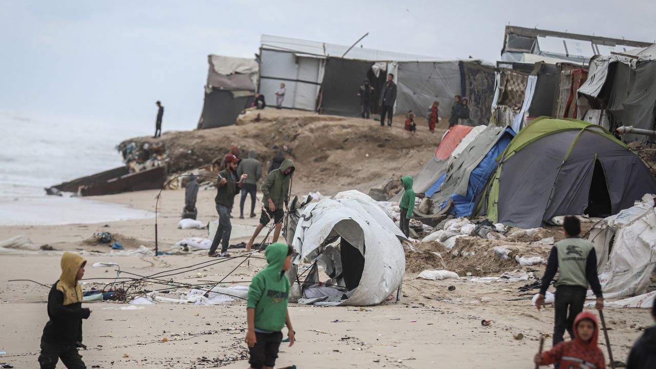 Damaged temporary shelters for displaced Palestinians after bad weather on a beach near Deir al-Balah, central Gaza, on Monday, Nov. 25, 2024. The United Nations says there's a humanitarian crisis in Gaza, adding that aid organizations are struggling to provide enough assistance. Photographer: Ahmad Salem/Bloomberg via Getty Images