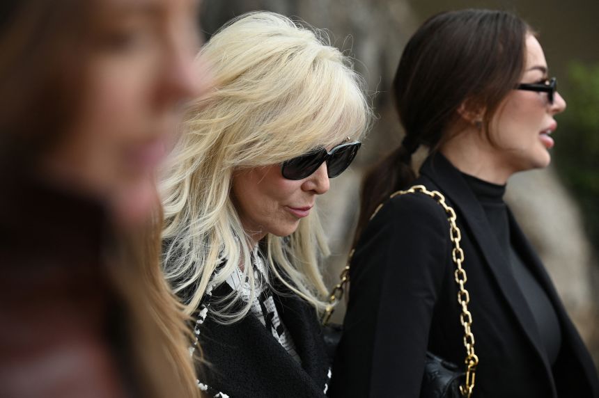 Erik Menendez's wife, Tammi Menendez, center, leaves the Van Nuys West Courthouse after a status hearing on the murder conviction of Lyle and Erik Menendez on November 25, 2024.