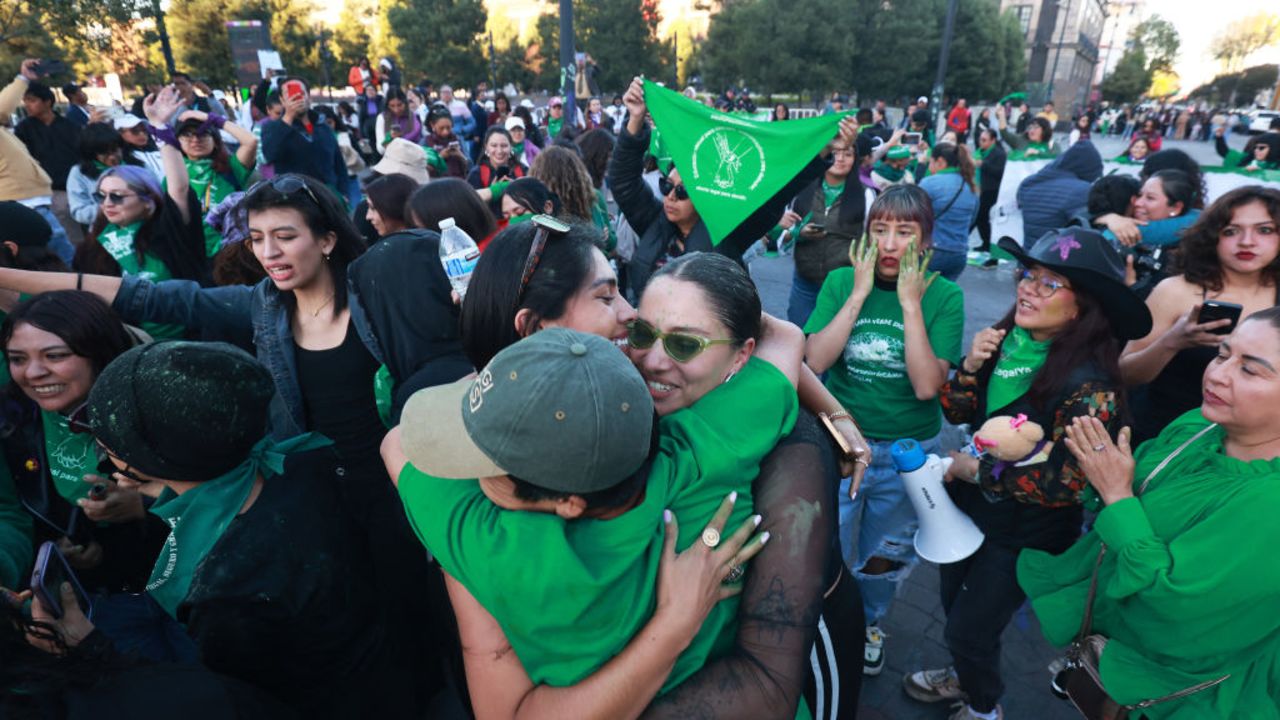 Members of feminist groups celebrate outside the Congress of the State of Mexico in Toluca on November 25, 2024, where deputies discuss the bill to decriminalize abortion. The Congress of the State of Mexico (center) decriminalized abortion up to 12 weeks of gestation on Monday, bringing the total number of states that have adopted similar legislation in Mexico to 18 out of 32, the chamber announced. (Photo by Angel Perez / AFP) (Photo by ANGEL PEREZ/AFP via Getty Images)