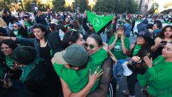 Members of feminist groups celebrate outside the Congress of the State of Mexico in Toluca on November 25, 2024, where deputies discuss the bill to decriminalize abortion. The Congress of the State of Mexico (center) decriminalized abortion up to 12 weeks of gestation on Monday, bringing the total number of states that have adopted similar legislation in Mexico to 18 out of 32, the chamber announced. (Photo by Angel Perez / AFP) (Photo by ANGEL PEREZ/AFP via Getty Images)