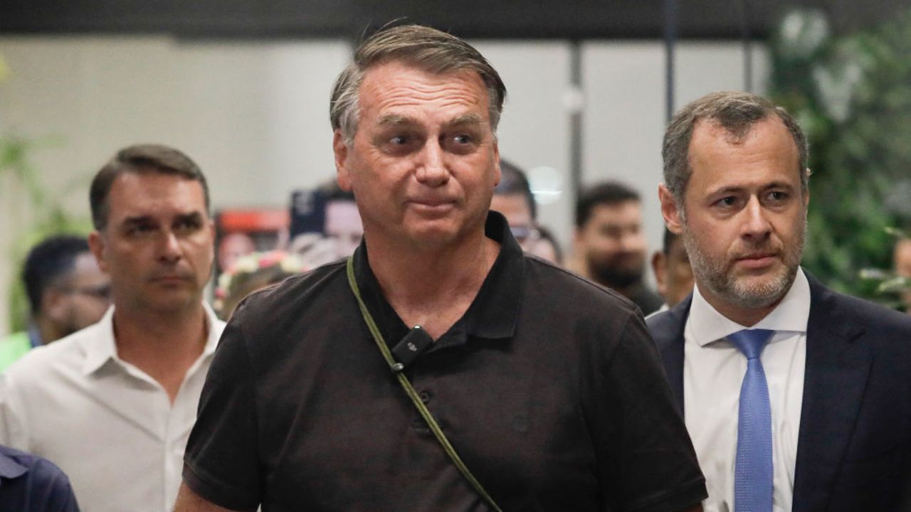 Brazil's former President Jair Bolsonaro arrives at the President Juscelino Kubitschek International Airport in Brasilia on November 25, 2024. Brazilian police on November 21 called for the indictment of ex-president Jair Bolsonaro over a 2022 "coup" plot to prevent current leader Luiz Inacio Lula da Silva from taking office. (Photo by Sergio Lima / AFP) (Photo by SERGIO LIMA/AFP via Getty Images)