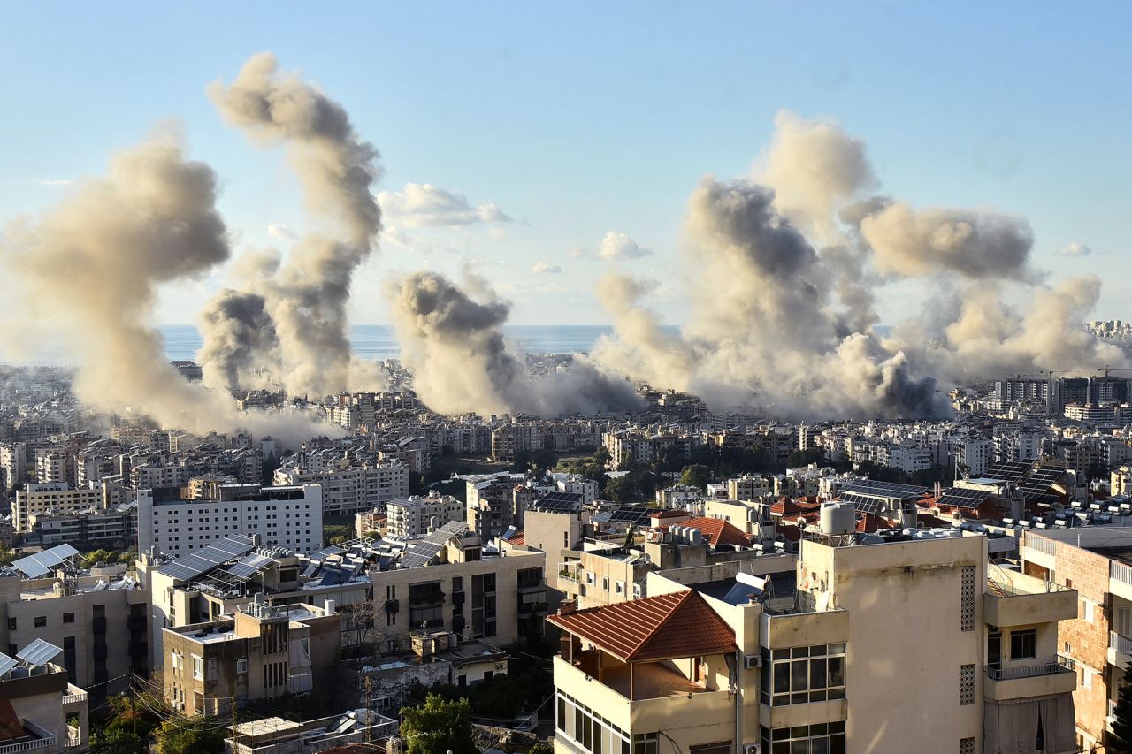 Smoke billows above Beirut's southern suburbs following an Israeli airstrike on November 26.
