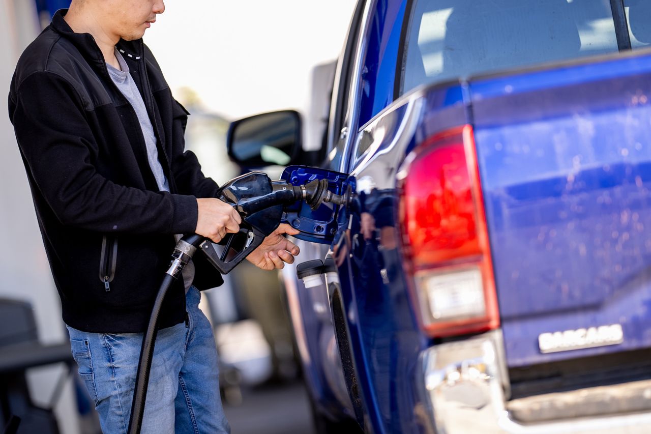 A man stops to fill up his car at a gas station in Washington DC, on November 26.