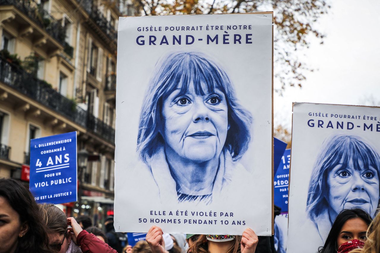 Demonstrators hold signs featuring Gisele Pelicot's likeness during a march against sexual violence in Paris, France, on November 23.