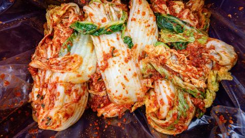 Freshly prepared kimchi, a traditional Korean dish of spicy fermented cabbage and radish, is seen during a kimchi making festival at the Jogyesa Temple in Seoul on November 27, 2024.