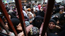 Palestinians wait for bread outside a bakery in the Nuseirat camp in central Gaza on November 27, 2024, amid the ongoing war in the Palestinian territory between Israel and Hamas. (Photo by Eyad BABA / AFP) (Photo by EYAD BABA/AFP via Getty Images)