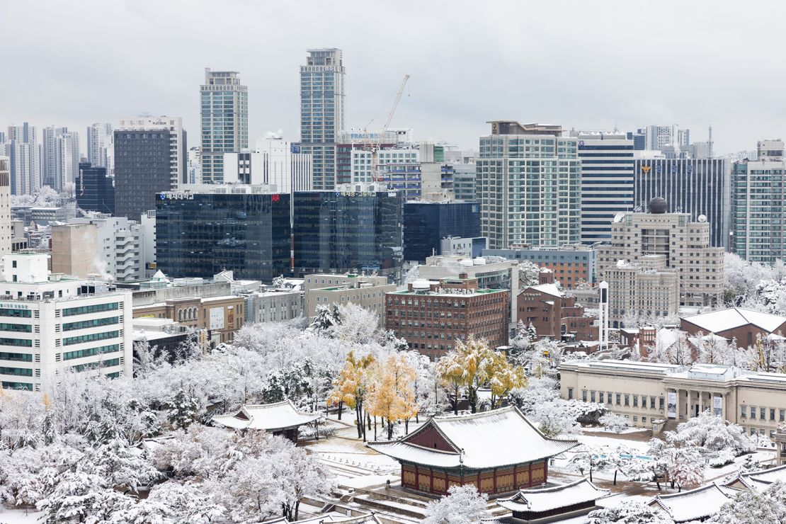 Commercial buildings during the first snow of the season, in Seoul.