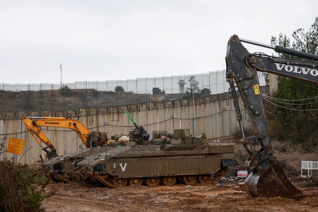 Israeli army tanks and bulldozers are pictured on the border with Lebanon in the upper Galilee region of northern Israel on Wednesday.