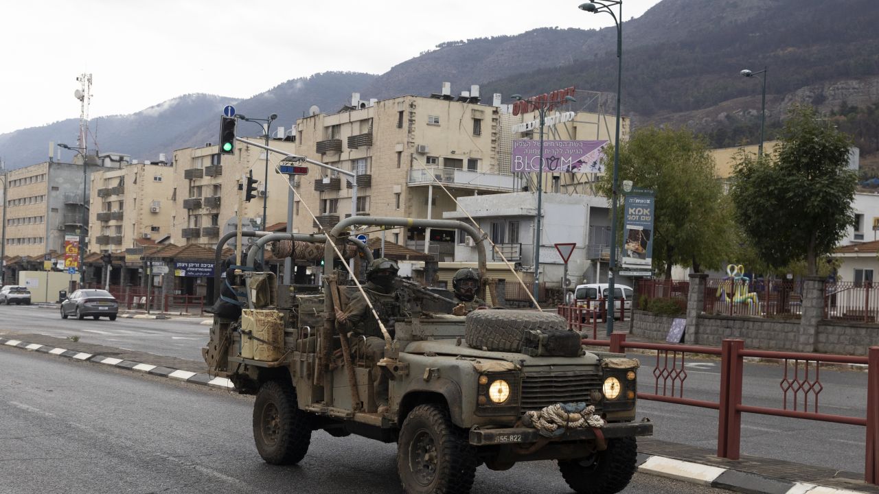 KIRYAT SHMONA, ISRAEL - NOVEMBER 27: An Israeli army vehicle moves in the city following a ceasefire agreement on November 27, 2024. Israeli Prime Minister Benjamin Netanyahu made a statement on Tuesday, confirming that the Israeli security cabinet approved a ceasefire agreement with Hezbollah, the Iran-backed Lebanese militant group. The two sides have been trading cross-border fire since October 2023, following the Hamas attacks on Israel, and Israel's subsequent incursions into Gaza and southern Lebanon. (Photo by Amir Levy/Getty Images)