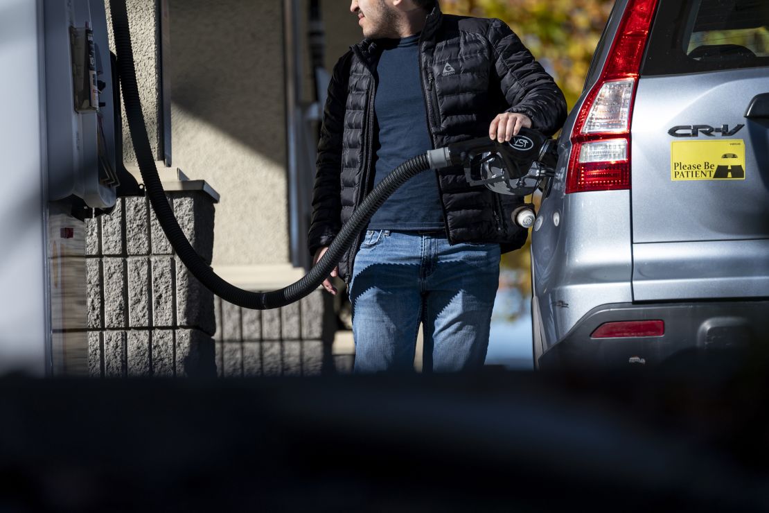 A customer refuels at a gas station in Hercules, California, on November 27, 2024.