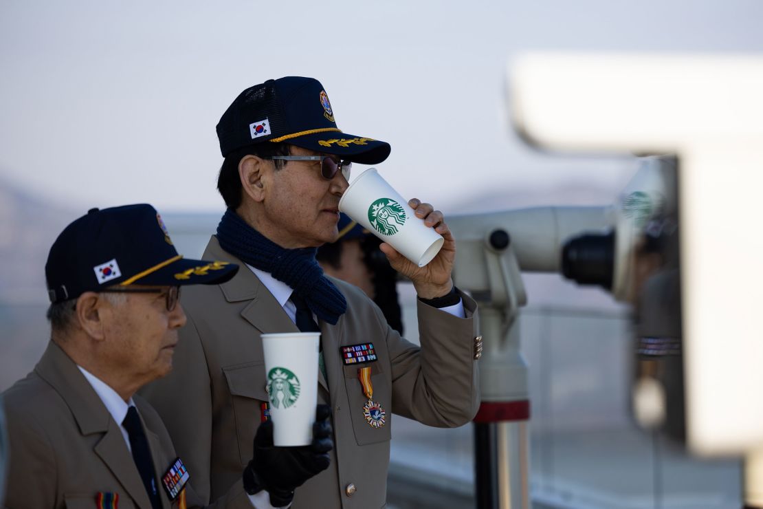 South Korean veterans drink coffee at an observation deck of the Starbucks Coffee in Gimpo.