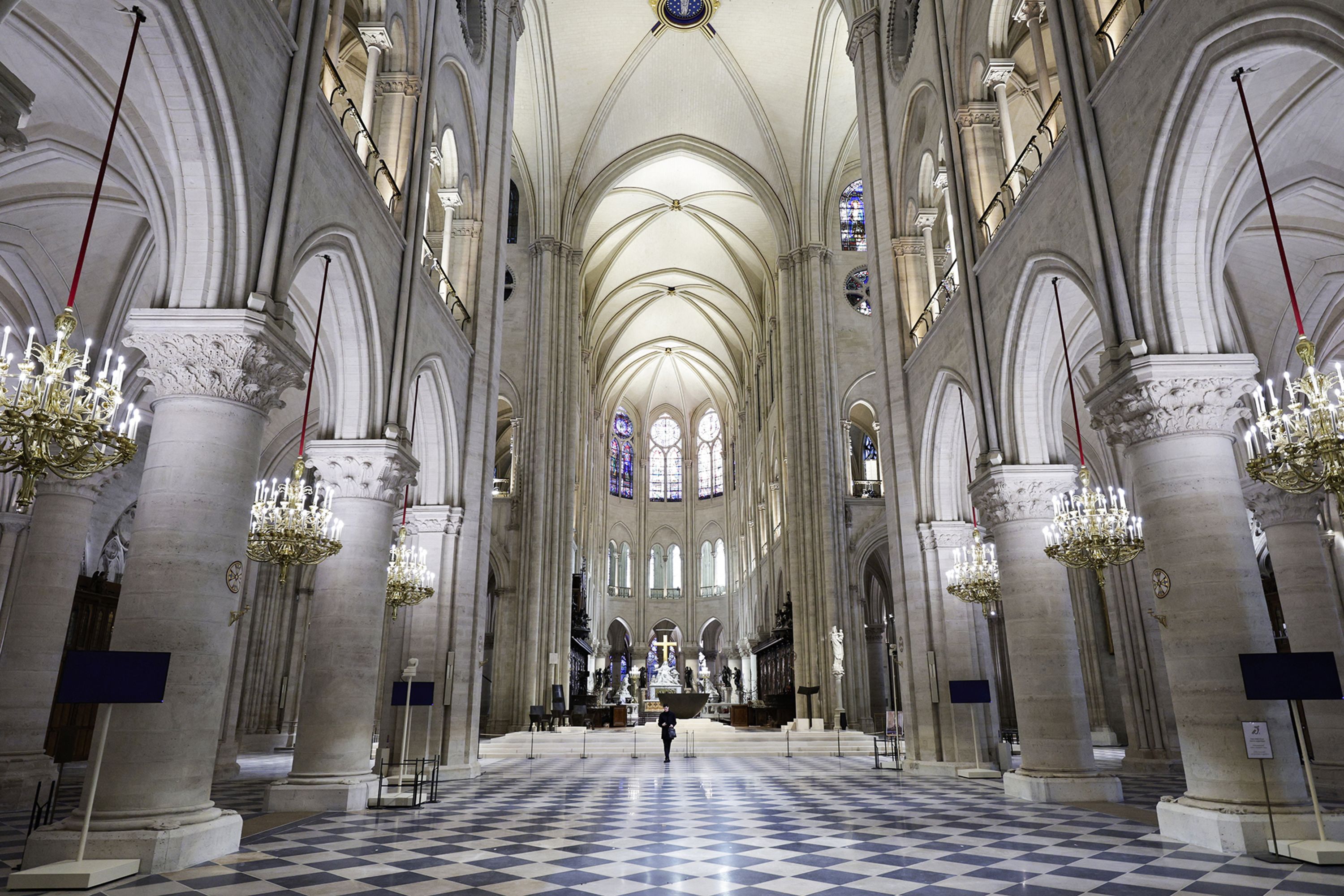 The nave of Notre Dame cathedral. Some 250 companies and hundreds of experts were mobilized for the five-year restoration costing hundreds of millions of euros.