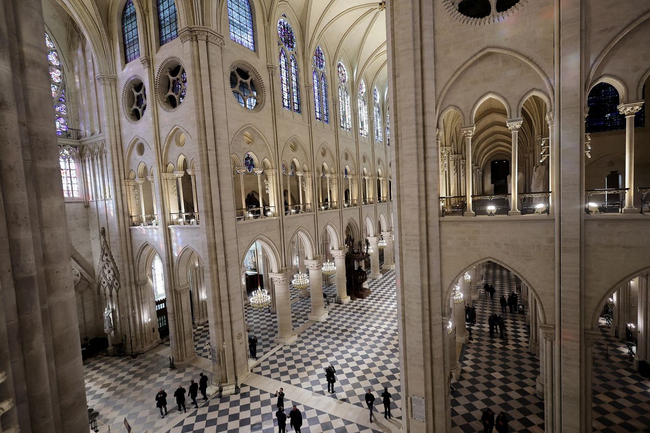 This photograph shows a general view of interior of Notre Dame cathedral.