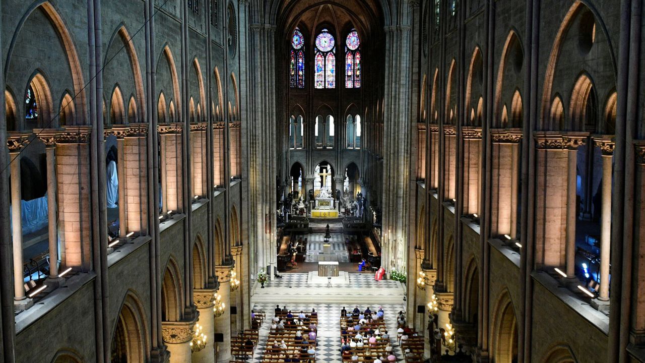 (COMBO) This combination of pictures created on November 29, 2024 shows the nave of Notre-Dame de Paris cathedral in Paris on November 29, 2024 (TOP) and on June 28, 2017 (BOTTOM). The Notre-Dame Cathedral is set to re-open early December 2024, with a planned weekend of ceremonies on December 7 and 8, 2024, five years after the 2019 fire which ravaged the world heritage landmark and toppled its spire. Some 250 companies and hundreds of experts were mobilised for the five-year restoration costing hundreds of millions of euros. (Photo by Sarah Meyssonnier and Martin BUREAU / various sources / AFP) (Photo by SARAH MEYSSONNIERMARTIN BUREAU/POOL/AFP/AFP via Getty Images)