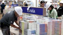 Workers wearing hard hats organize books from publishers during preparations prior to the opening of the 38th edition of the Guadalajara International Book Fair in Guadalajara, Mexico, on November 29, 2024. The 38th edition of Guadalajara International Book Fair will be held from November 30 to December 8, with Spain as the guest of honor. (Photo by ULISES RUIZ / AFP) (Photo by ULISES RUIZ/AFP via Getty Images)