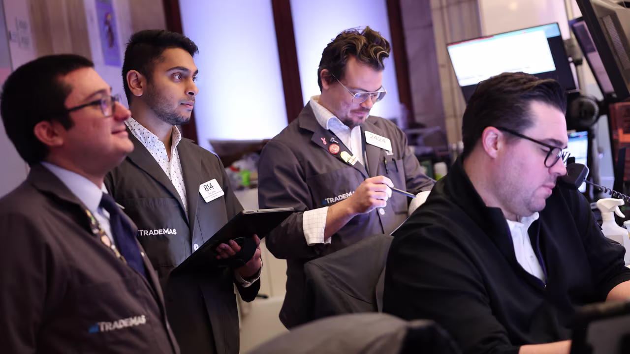 Traders work on the floor of the New York Stock Exchange on November 26.