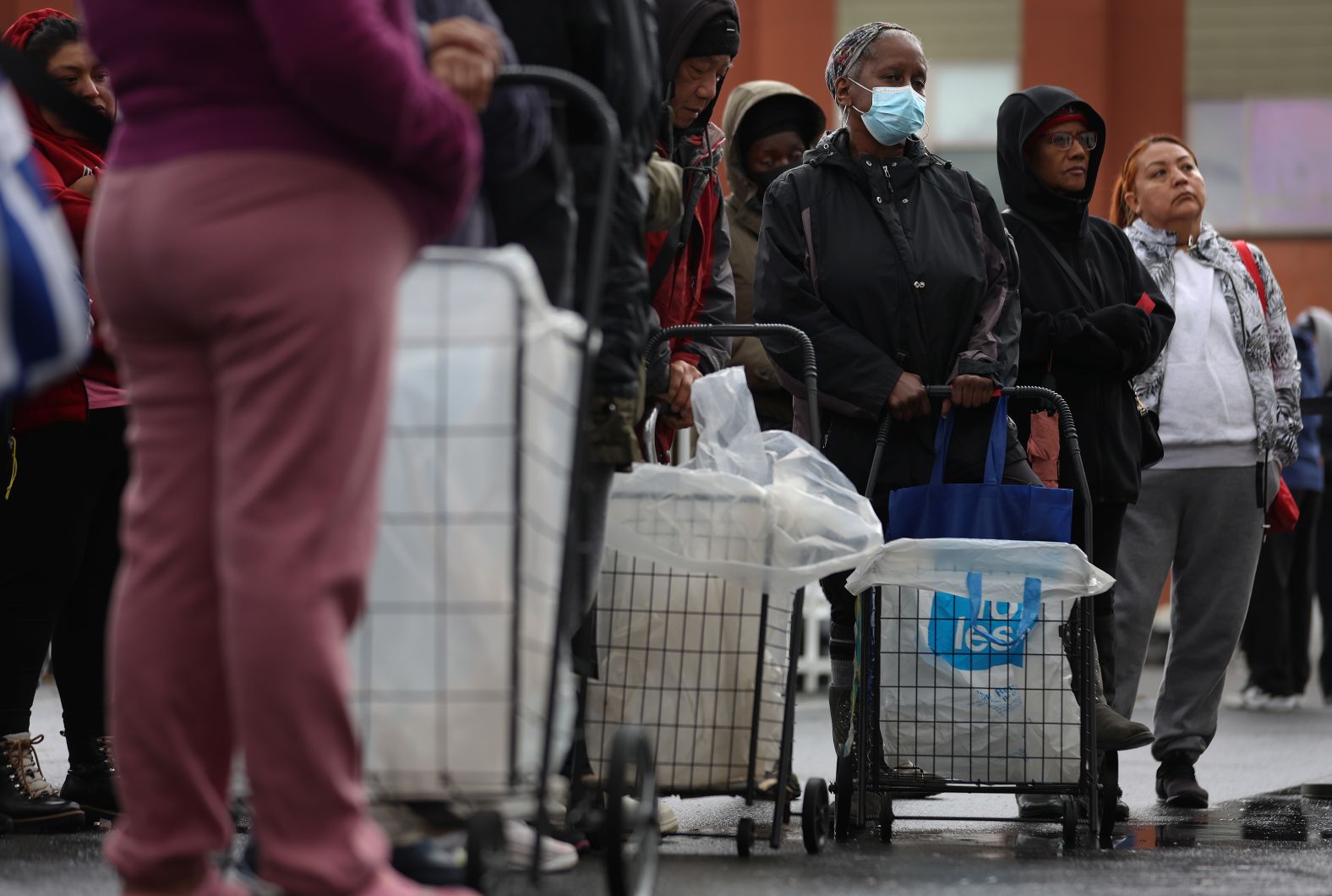 People wait in line Tuesday before the Bay Area Rescue Mission's annual turkey giveaway in Richmond, California.