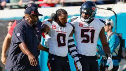 Houston Texans linebacker Azeez Al-Shaair (No. 0) was escorted off the field after being ejected from Sunday's game against the Jacksonville Jaguars