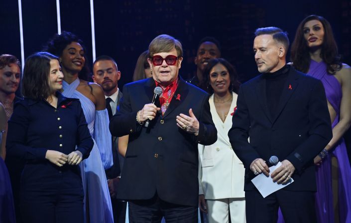 John speaks on stage alongside his husband, David Furnish, at a gala performance of the “The Devil Wears Prada” musical in December 2024. “I haven’t been able to come to many of the previews because, as you know, I have lost my eyesight," <a href="index.php?page=&url=https%3A%2F%2Fwww.cnn.com%2F2024%2F12%2F02%2Fentertainment%2Felton-john-eyesight-scli-intl%2Findex.html">he told the audience in London</a>. "So it’s hard for me to see it. But I love to hear it and, boy, it sounded good tonight.” John wrote the score for the show.