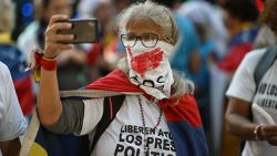 Relatives of people detained during protests following the disputed July 28 presidential elections and of other political prisoners take part in a demonstration demanding their release in Caracas on December 1, 2024. (Photo by JUAN BARRETO / AFP) (Photo by JUAN BARRETO/AFP via Getty Images)