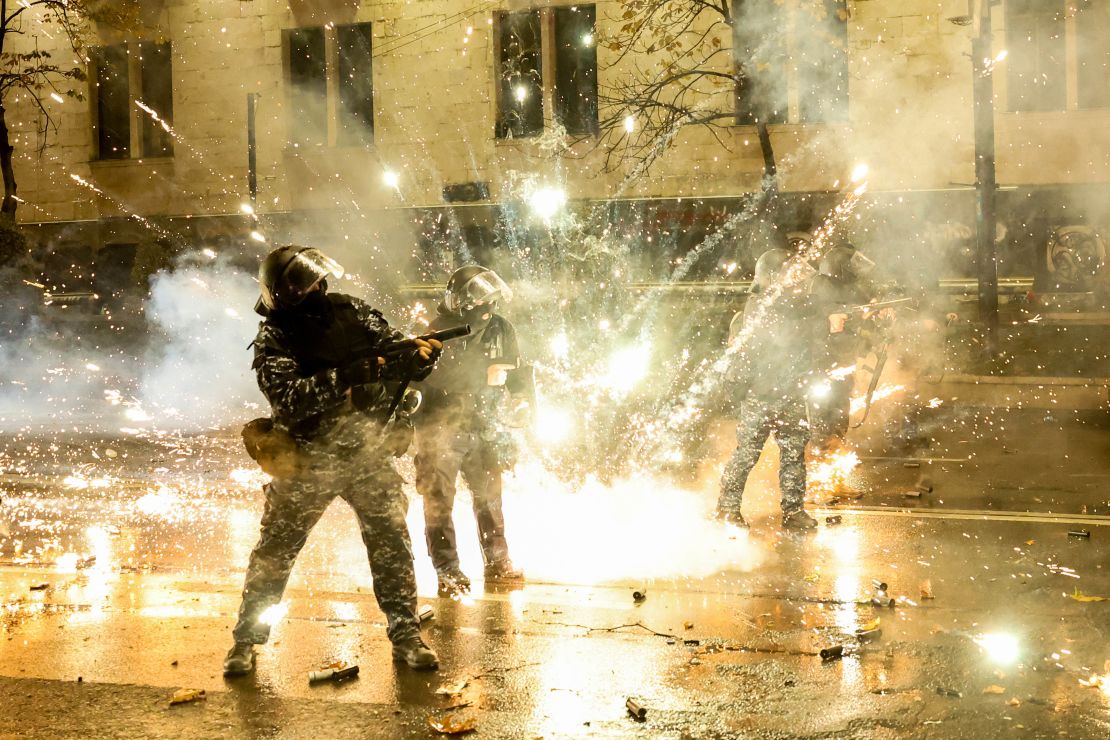 TOPSHOT - Protesters shoot fireworks toward police during a fourth day of nationwide protests against a government decision to shelve EU membership talks in Tbilisi early on December 2, 2024. Police in Georgia fired tear gas and water cannon on a fourth straight day of pro-EU protests that drew tens of thousands of people, as the prime minister rebuffed calls for new elections. (Photo by Giorgi ARJEVANIDZE / AFP) (Photo by GIORGI ARJEVANIDZE/AFP via Getty Images)