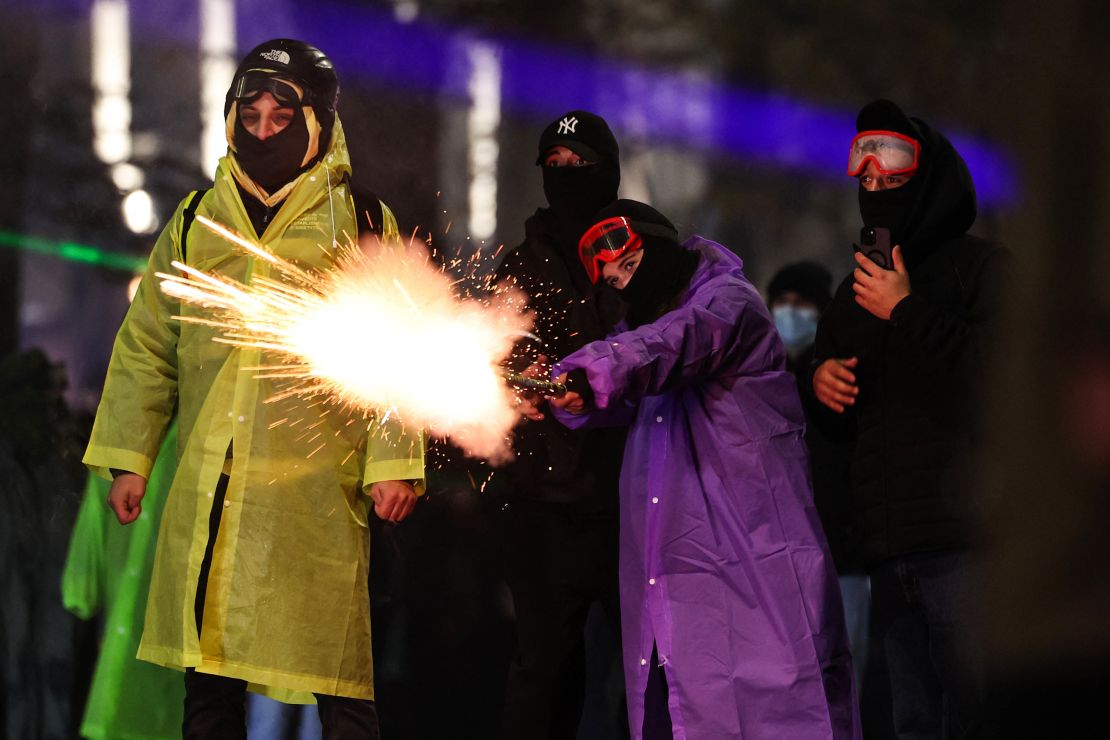 Protesters shoot fireworks toward police during a fourth day of nationwide protests against a government decision to shelve EU membership talks in Tbilisi early on December 2, 2024. Police in Georgia fired tear gas and water cannon on a fourth straight day of pro-EU protests that drew tens of thousands of people, as the prime minister rebuffed calls for new elections. (Photo by Giorgi ARJEVANIDZE / AFP) (Photo by GIORGI ARJEVANIDZE/AFP via Getty Images)