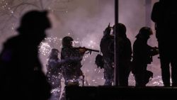 Protesters shoot fireworks toward police during a fourth day of nationwide protests against a government decision to shelve EU membership talks in Tbilisi early on December 2, 2024. Police in Georgia fired tear gas and water cannon on a fourth straight day of pro-EU protests that drew tens of thousands of people, as the prime minister rebuffed calls for new elections. (Photo by Giorgi ARJEVANIDZE / AFP) (Photo by GIORGI ARJEVANIDZE/AFP via Getty Images)