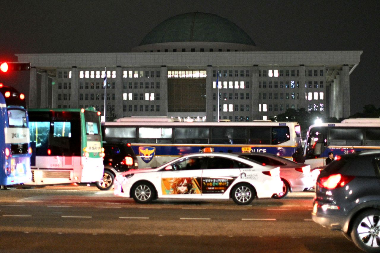 Police buses are seen outside the National Assembly in Seoul after South Korea President Yoon Suk Yeol declared emergency martial law.