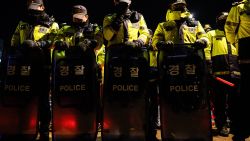 Police stand guard near the South Korean Presidential Office and the Defence Ministry in Seoul early on December 4, 2024, after South Korean President Yoon Suk Yeol declared martial law. South Korea's President Yoon Suk Yeol on December 3 declared martial law, accusing the opposition of being "anti-state forces" and saying he was acting to protect the country from "threats" posed by the North. (Photo by ANTHONY WALLACE / AFP) (Photo by ANTHONY WALLACE/AFP via Getty Images)