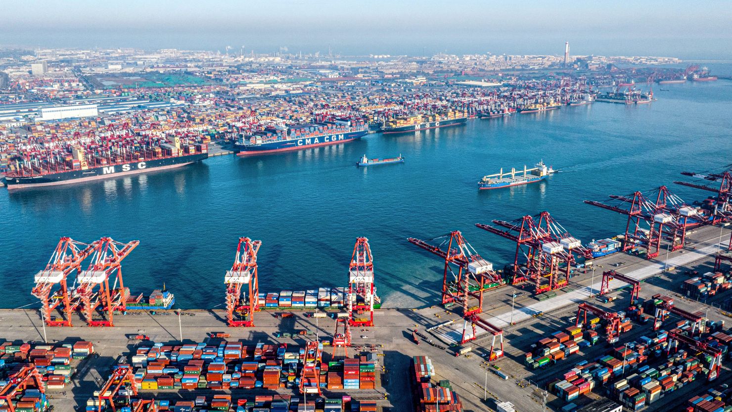 Shipping containers and gantry cranes at Qingdao port in eastern China's Shandong province, seen on December 4, 2024.