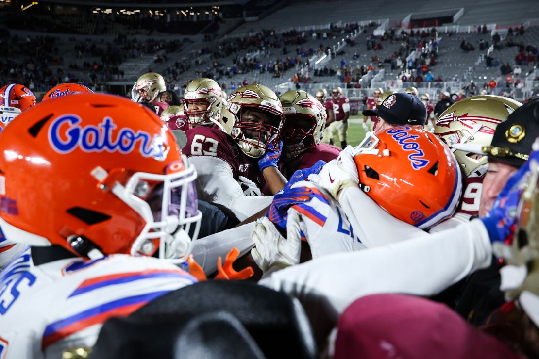 The Florida Gators and Florida State Seminoles grapple after last weekend's game.